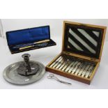 A cased set of abalone-handled flatware, a Tudric pewter charger,