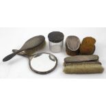 A hallmarked silver dressing table set comprising four gentlemen's brushes,