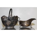 A Victorian hallmarked silver swing-handle sugar basket and a George V sauce boat,