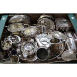 A large quantity of plated ware to include biscuit barrel, gallery-edged oval tray, spirit kettle,