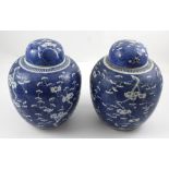 A pair of large 19th century blue and white ginger jars and covers,