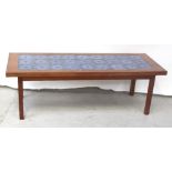 A vintage mahogany tile-top table on block supports, length 157cm.