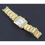 Genève; a ladies' 18ct gold tank style wristwatch the white enamel dial set with Roman numerals,