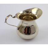 A George V hallmarked silver creamer, Birmingham 1928, maker's mark rubbed, approx 2.2ozt.