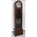 An Art Deco oak arched-top longcase clock with three-train movement chiming,