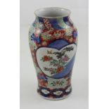 A late 19th/early 20th century Chinese baluster vase, iron red and cobalt blue ground,