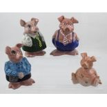 Four Wade 'Piggy' banks (one in faded condition) (4).