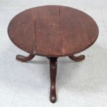 A small mahogany circular side table on tripartite cabriole supports, 40 x 60cm (af).