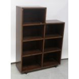 A c1970 twin bank of mahogany and teak open bookshelves, height approx 110cm.