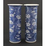 A pair of Chinese blue and white sleeve vases with prunus blossom decoration,