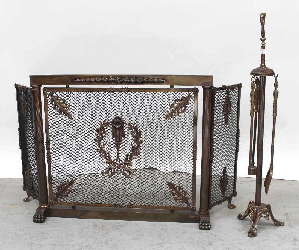 A metal Georgian-style fire screen with metal lattice work to the front, ornate acanthus leaves,