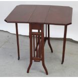 A mid-20th century mahogany drop-leaf tea/trolley table on curved tapering supports and castors,