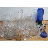 A quantity of cut glass, crystal and other glassware to include decanters, wine glasses,