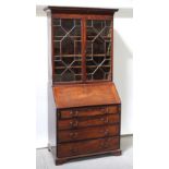 A George III mahogany bureau bookcase,