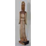 A South East Asian yak bone carved Guanyin in long robes on wooden base, height 35cm.