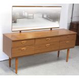 A retro teak-effect rectangular mirror-back dressing table with two central long drawers and two