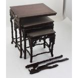 An early 20th century set of three Oriental hardwood miniature tables with stylised bamboo