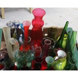 A collection of coloured studio glass vases, various sizes, shapes and colours,