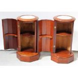 A pair of Victorian mahogany marble-top nightstands modelled as fluted columns, on octagonal bases,