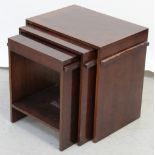 An Art Deco style mahogany nest of three tables.