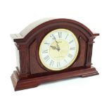 A modern stained oak and burR walnut Seiko Quartz mantel clock with Westminster and Whittington