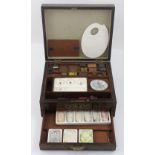 A 19th century rosewood and brass inlaid paint box with some blocks of watercolour,