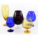 A collection of mid-20th century coloured glass goblet vases in amber glass,
