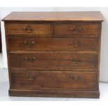 An Edward VII oak chest of two-over-three graduated drawers on plinth base, height 92cm.