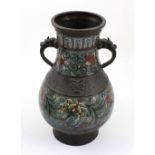 A 19th century Chinese bronze and enamel archaistic-style cloisonné vase with kylin mask handles,