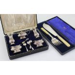 A George VI hallmarked silver cased five-piece cruet set comprising two salts, two pepper pots,