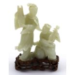 A fine late 18th/early 19th century Chinese carved jade figure of two female musicians,