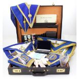 A brown leather attaché case containing a quantity of Masonic memorabilia relating to the