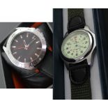 A Ricardo steel cased water resistant diving watch on green material strap,