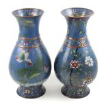 A pair of Japanese cloisonné baluster vases, turquoise ground with polychrome decoration of flora,