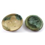 A small Guan-style dish with flashes of turquoise glaze and stilt marks,