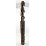 An early 20th century Iban or Dayak carved monkey totem with animal figure surmounting a geometric