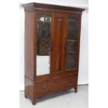 A late Victorian red walnut two-door wardrobe, each set with pane of bevelled glass,