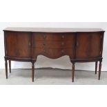 A reproduction serpentine-front mahogany sideboard,