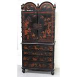 An early 18th century Queen Anne style Chinoiserie cabinet on chest,