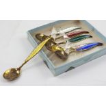 A cased set of six Norwegian hallmarked silver Ottac Hval, silver gilt and enamelled coffee spoons,