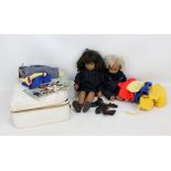 SASHA; two male and female dolls, the former dressed in navy jumper and dungarees and the latter