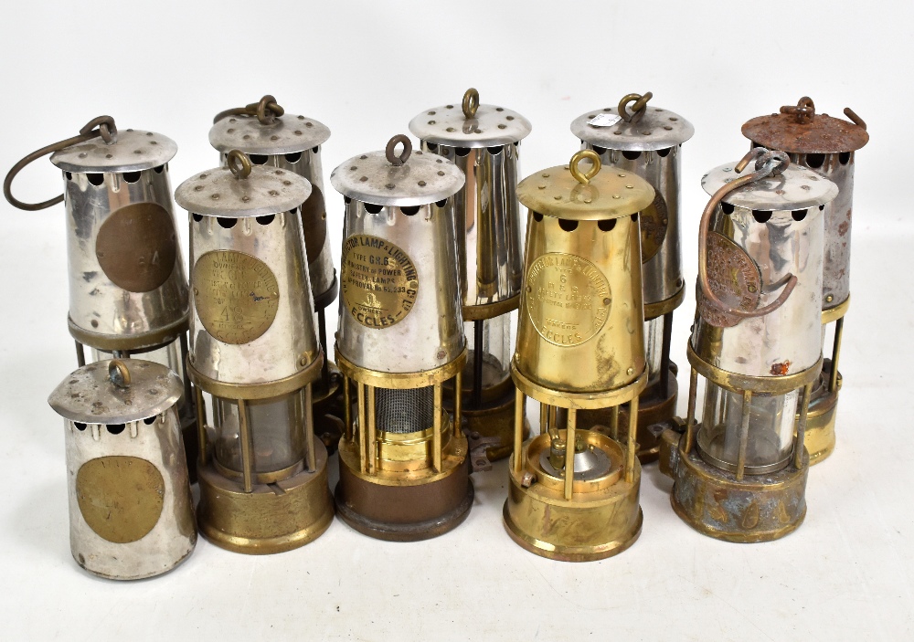 Nine miners' safety lamps including Protector Lamp & Lighting Co Ltd Eccles examples, two lacking