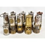 Nine miners' safety lamps including Protector Lamp & Lighting Co Ltd Eccles examples, two lacking