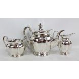 ATKIN BROTHERS; a George V hallmarked silver three piece tea set comprising oval teapot with