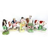 A group of 19th century Staffordshire figures including an early figure of a gentleman with lamb