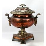 A Victorian copper twin handled tea urn, of bolster form on plinth base, with brass tap, height 40cm