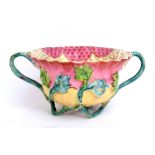 Eighteenth century English twin handled cup, the interior decorated with an exotic bird within a