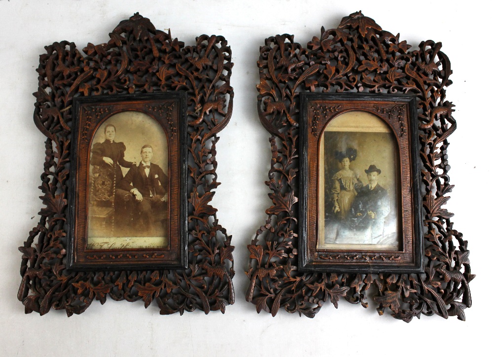 A pair of late 19th century Anglo-Indian carved and pierced wooden photograph frames, each frame