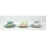 FOLEY CHINA; a floral decorated trio all with printed marks and pattern no. 7069 to bases, a further