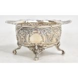 A late Victorian hallmarked silver and embossed bowl with shaped handles and four pierced